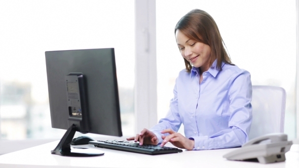 Busy Businesswoman With Telephone And Computer