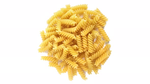 Fusilli pasta on white background