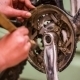 Young Girl Cleaning Bicycle Chainring With Brush - VideoHive Item for Sale