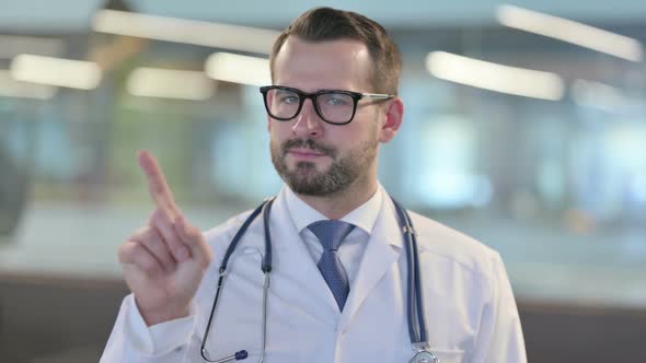 Portrait of No Sign By Young Male Doctor By Finger Gesture