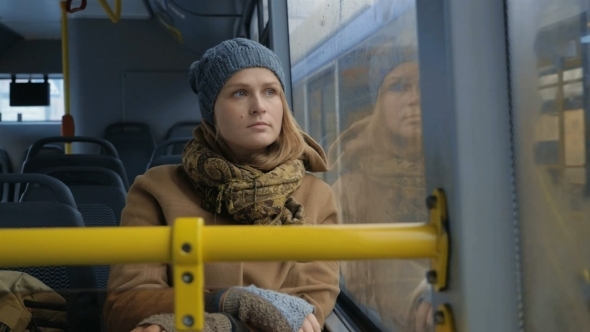 Woman Passenger Looking Out Bus Window
