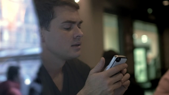 Man Writing Messages In Smartphone alt