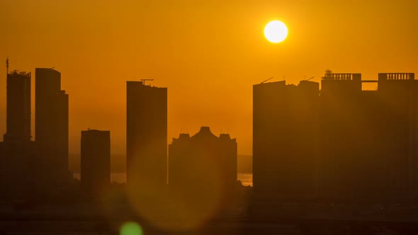 Buildings on Al Reem Island in Abu Dhabi at Sunset Timelapse From Above