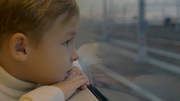 Boy By The Train Window