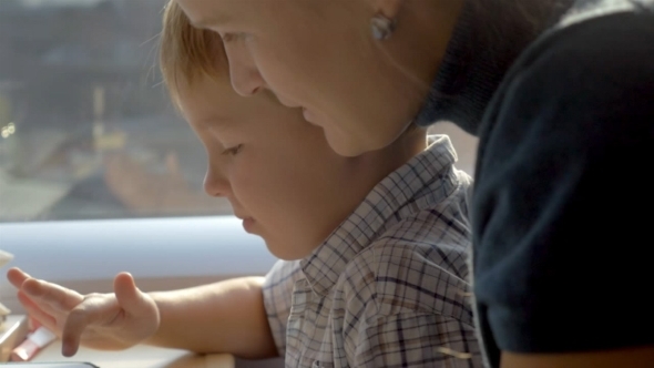Boy Playing Games In Tablet PC alt