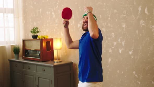 Good Looking Man Playing the Ping Pong at Home He