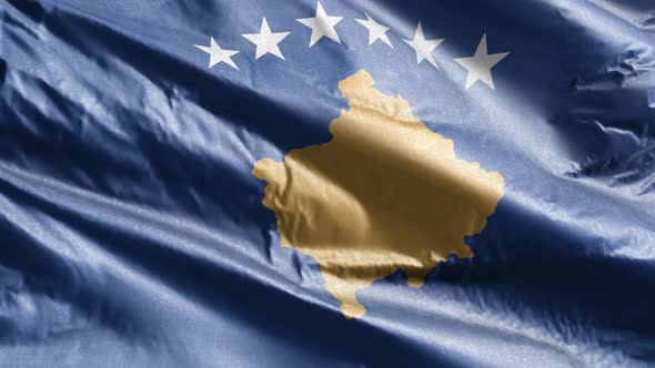 Kosovo textile flag waving on the wind. Slow motion. 20 seconds loop.