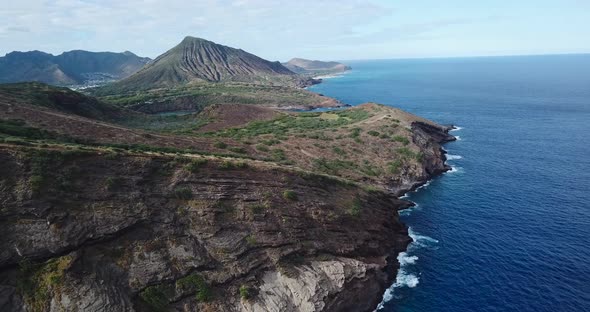 Drone shot of a cliffside beach showing views of the coast line