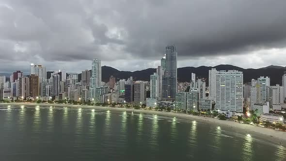 Aerial view of sea side resort city Balneario Camboriu with mountain range in Brazil