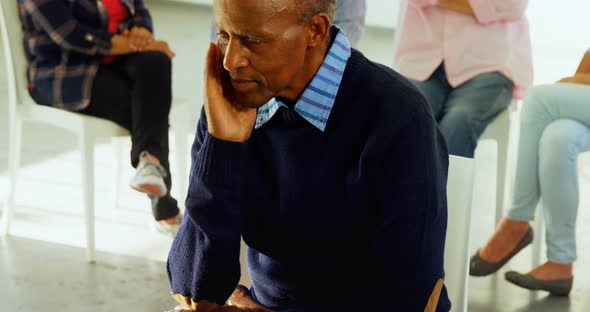 Senior man sitting at health center 4k