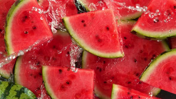 Super Slow Motion Shot of Splashing Water on Fresh Watermelon Slices at 1000Fps