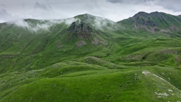 Dense Overcast Over Mountains And Green Hills