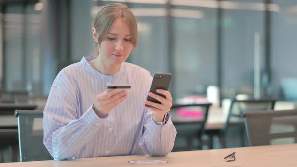 Young Woman Making Successful Online Payment on Smartphone