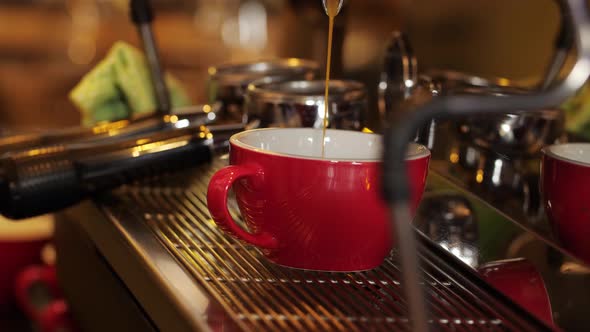 Espresso Dripping Into Red Cup