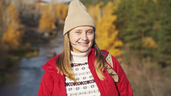 Caucasian Woman in Smiles and Braces are Visible on Her Teeth