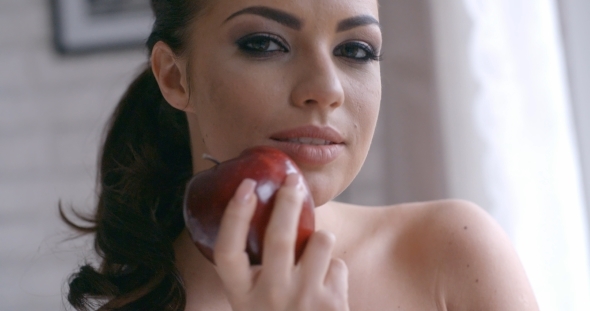 Sensual Pretty Young Woman Holding Red Apple alt
