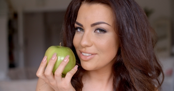Smiling Pretty Woman Holding Fresh Green Apple alt