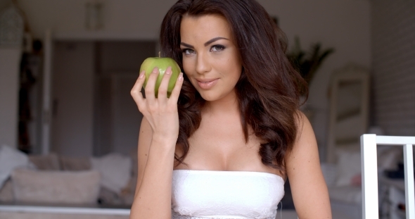 Seductive Young Woman Holding Fresh Green Apple