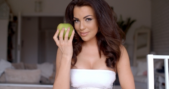 Seductive Young Woman Holding Fresh Green Apple alt