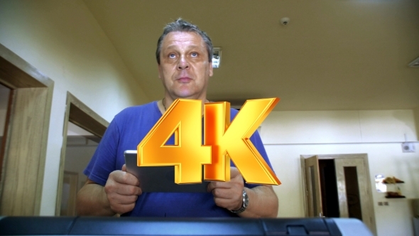 Man With Touch Pad Exercising On Treadmill