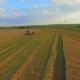 AERIAL VIEW. A Wheat Field Being Harvested - VideoHive Item for Sale