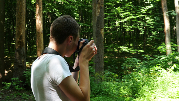 Teen In Wilderness Area Taking Picture