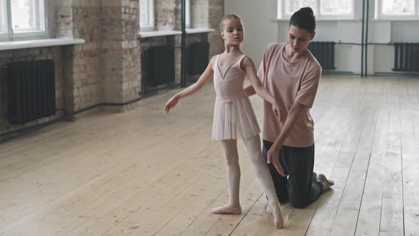 9-Year-Old Ballerina Pointing Toe At Ballet Class