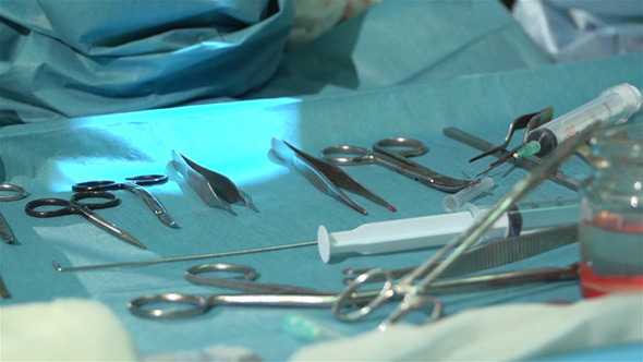 Surgical Instruments And Hands Of A Surgical Nurse