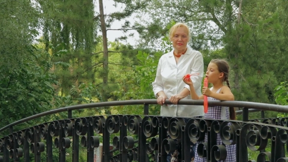 Blowing Bubbles On A Bridge