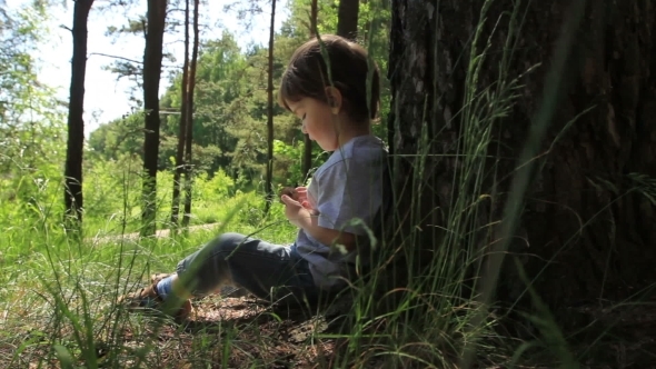 Baby Sitting Near a Tree