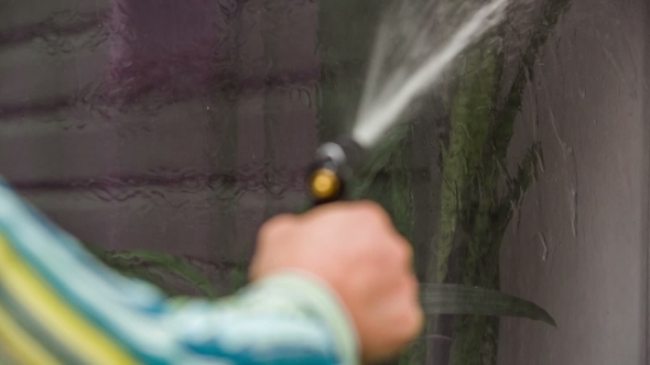 Human Hand Washing Window Of House 