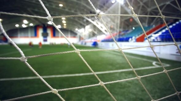 View Through Focused Net. Blurred Players Play On