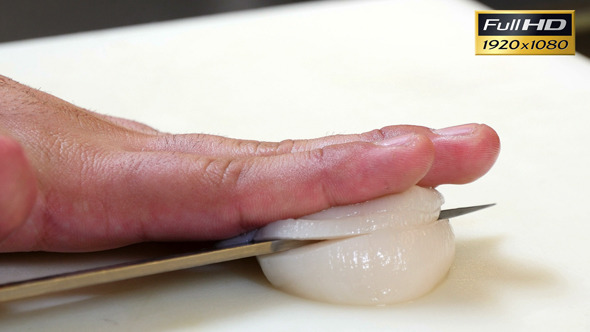 Sushi Chef Cutting a Scallop Sashimi Style