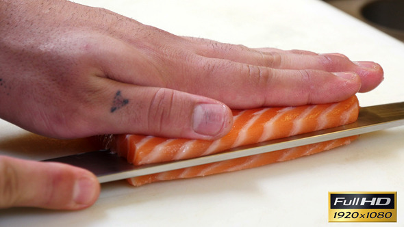 Sushi Chef Cutting a Salmon Steak Japanese Style