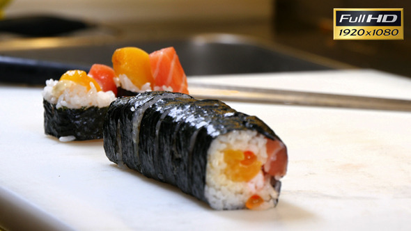 Sushi Chef Presenting Salmon Peach Futomaki Roll