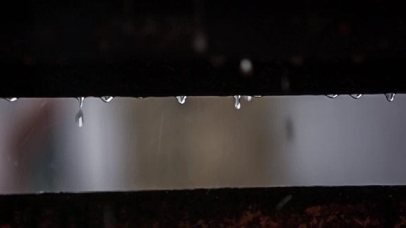 Raindrops Falling Between Wooden Planks