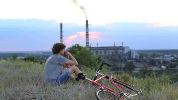 Cyclist on the Background of the Plant