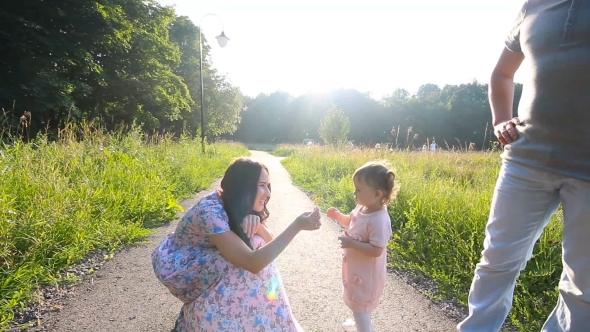 Beautiful Mother And Baby Outdoors. Nature.