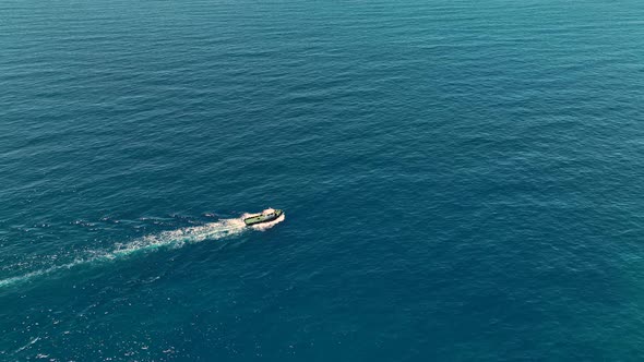 Tug boat sails in port aerial view 4 K Turkey Alanya