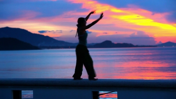 Happy Woman Jumping In Sea Sunset On Samui Island