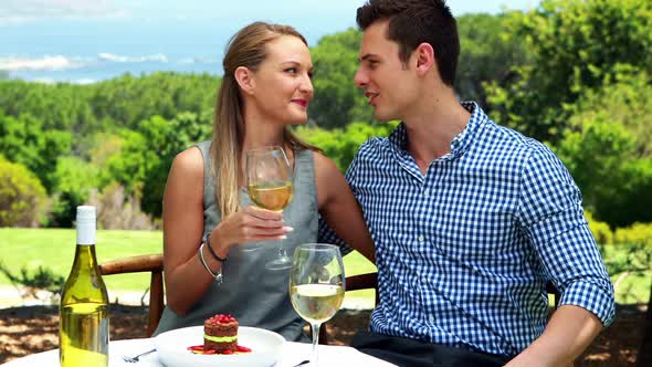 Couple toasting glasses of wine in outdoor restaurant 4k