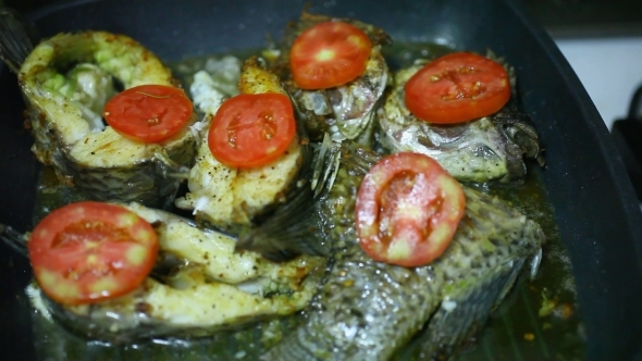 Frying Fish In a Grill Pan With Tomatoes, Cheese alt
