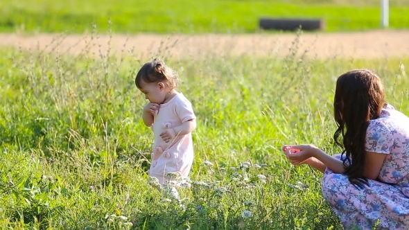 Beautiful Mother And Baby Outdoors. Nature. alt