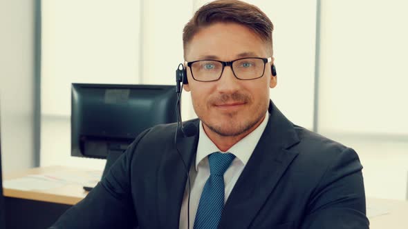 Business People Wearing Headset Working in Office