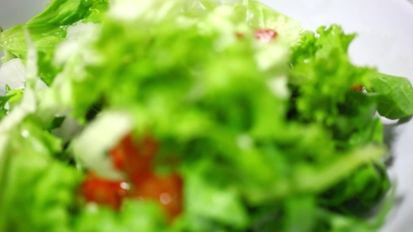 Putting Some Vegetables In a Bowl