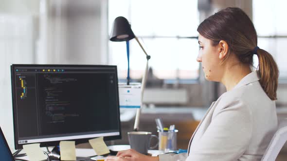 Female Programmer with Computer Working at Office 12