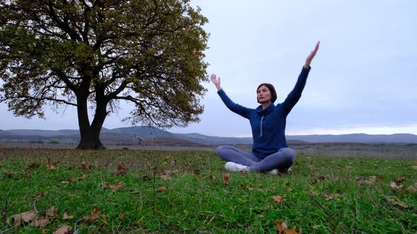 Woman Enjoy Yoga at Autumn Park Near Alone Oak