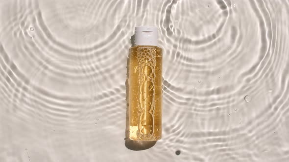 Cosmetic Bottle Vial for Oil Liquid Collagen Serum on Water Surface with Drops