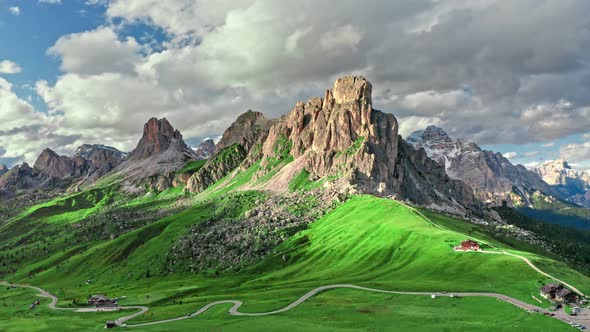 Passo Giau in Dolomites and green hills, aerial view, Italy