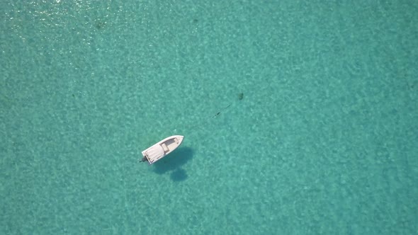 Aerial drone view of a fishing motor boat in the Bahamas, Caribbean. 